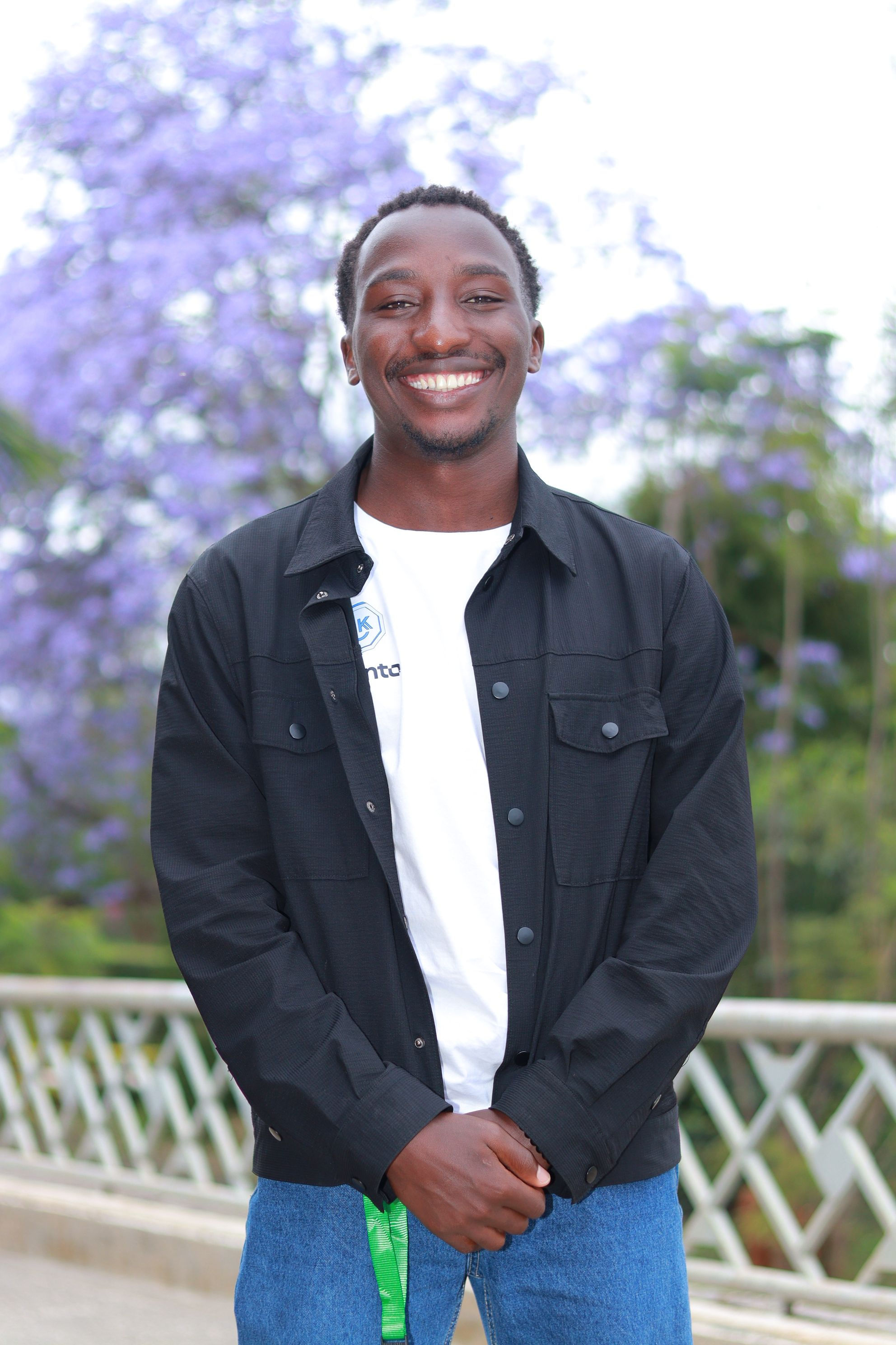 Ian Mongare smiling outdoors