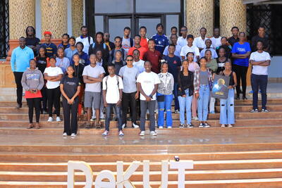 Students gathered outside the Dedan Kimathi University of Technology hall after a session