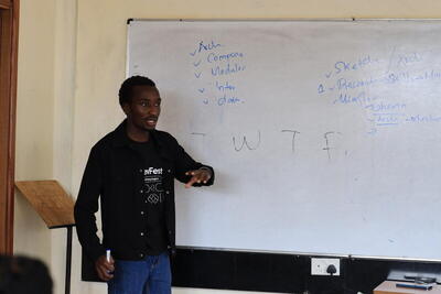 Teaching at a whiteboard during a workshop